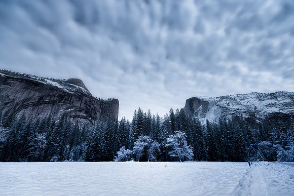 The Two Brothers, North Dome and Half Dome. View from the entrance of Curry Village